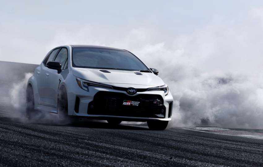 picture of GR Toyota Corolla going down a track with smoke behind it